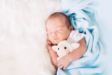 Beautiful baby sleeping with stuffed animal lamb to the sounds of lullabies from around the world, lullaby playlist